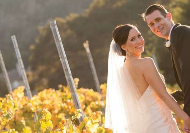 wedding couple in fall vineyard