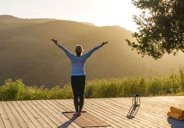 Yoga on deck with mountain view