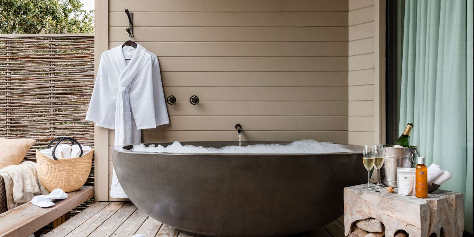Outdoor bath tub with champagne cooler and glasses