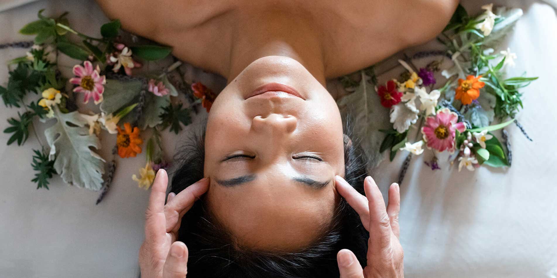 Person receiving treatment on massage table