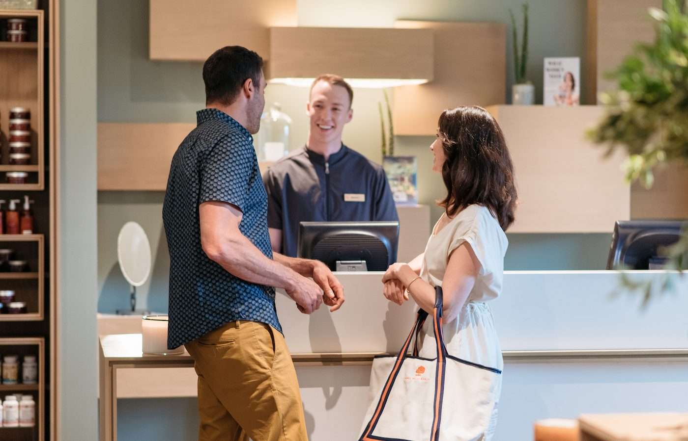 Couple talking to the Carmel Valley Ranch spa receptionist