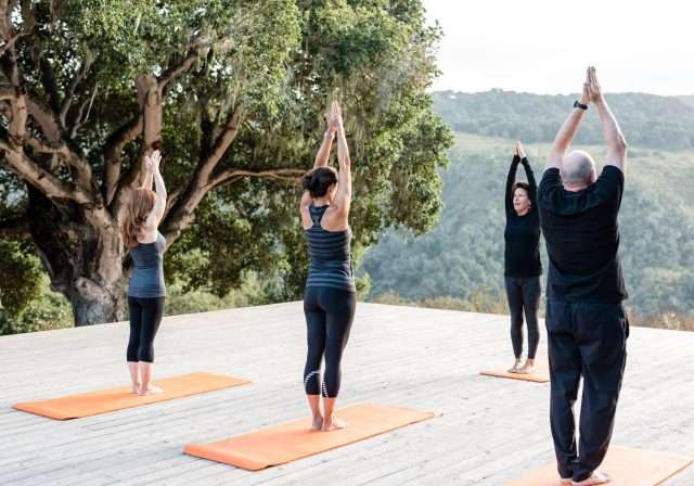 Group yoga on the outside terrace