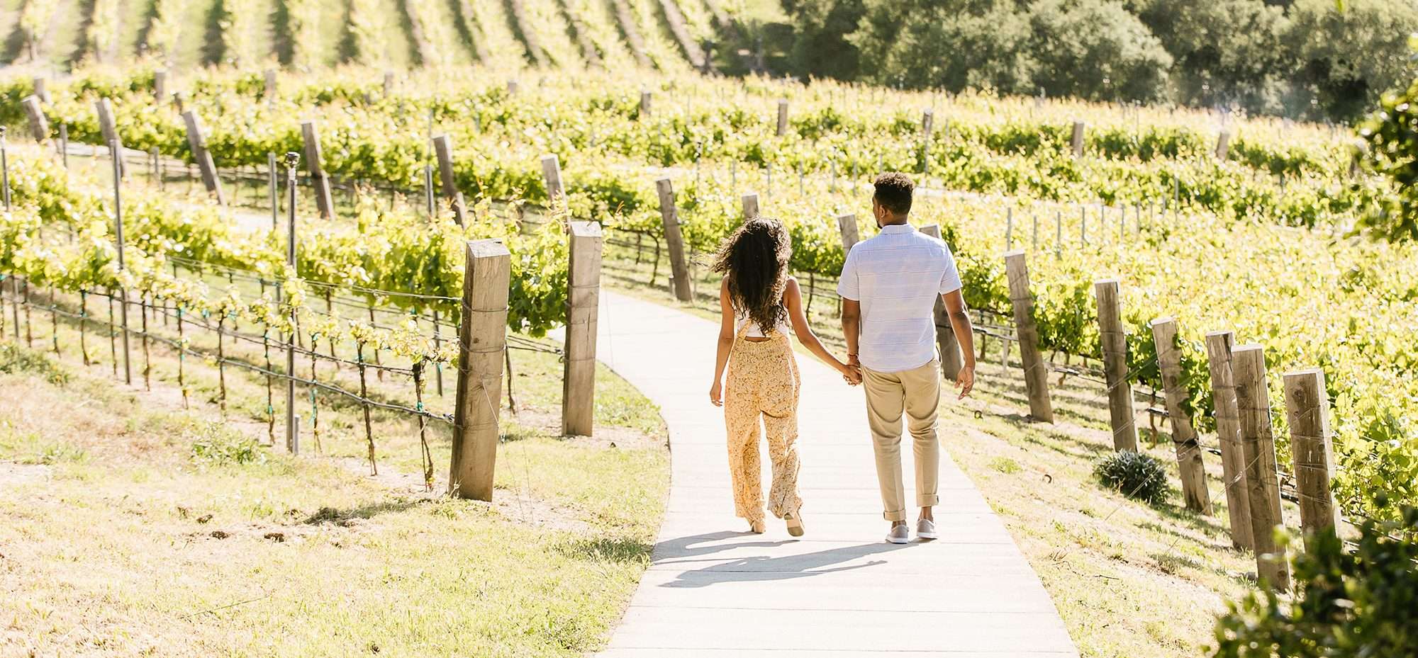 A couple strolling through CVR vineyards