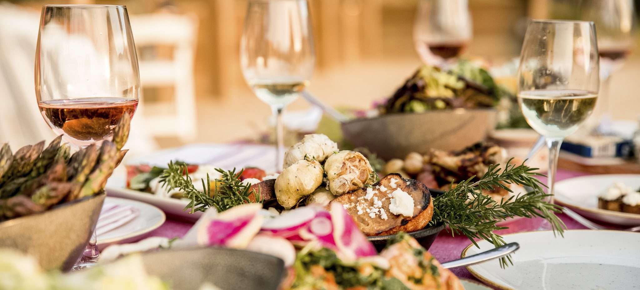 Food and wine on a table outdoors
