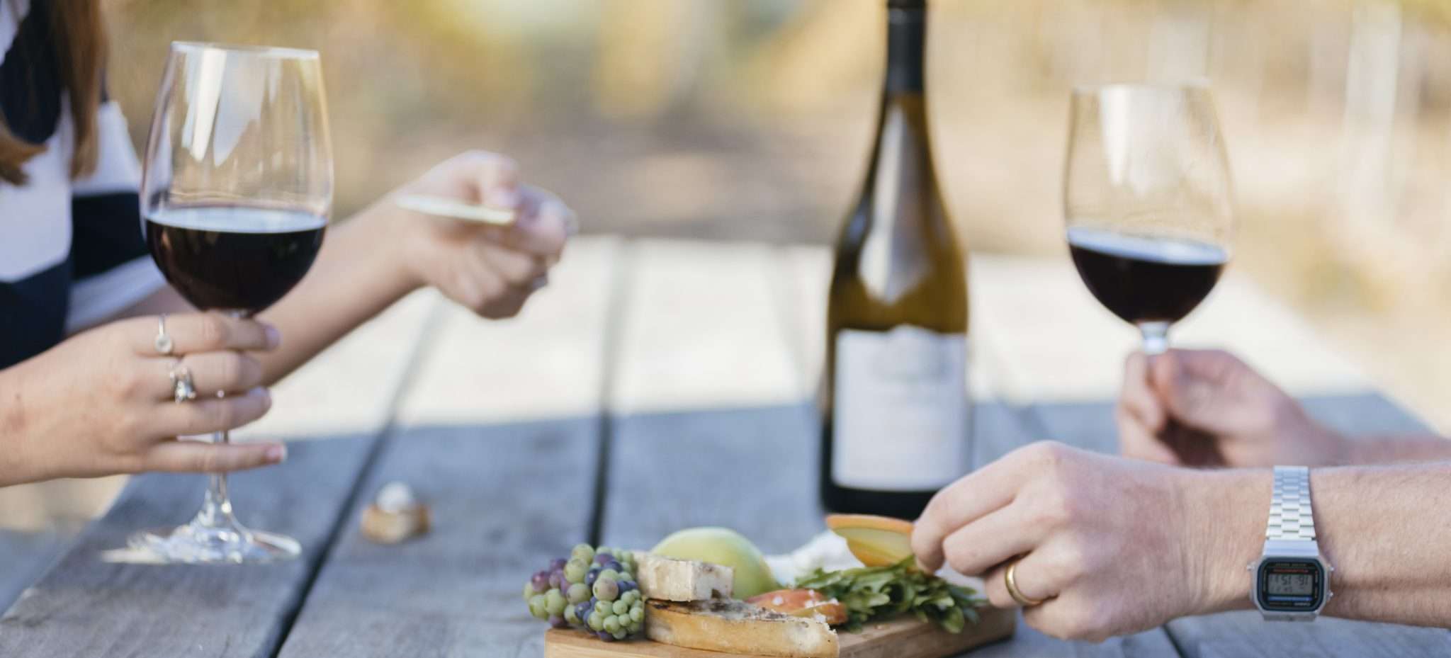 People drinking wine and enjoying crackers