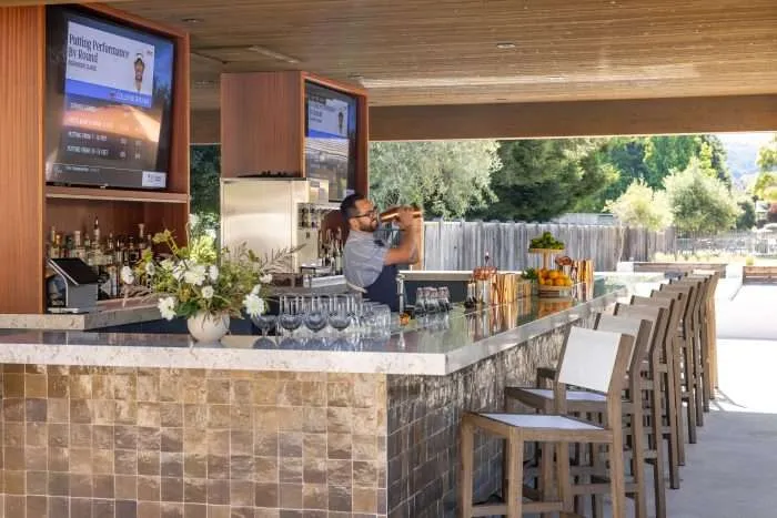 outdoor bar seating at river ranch bar & grill