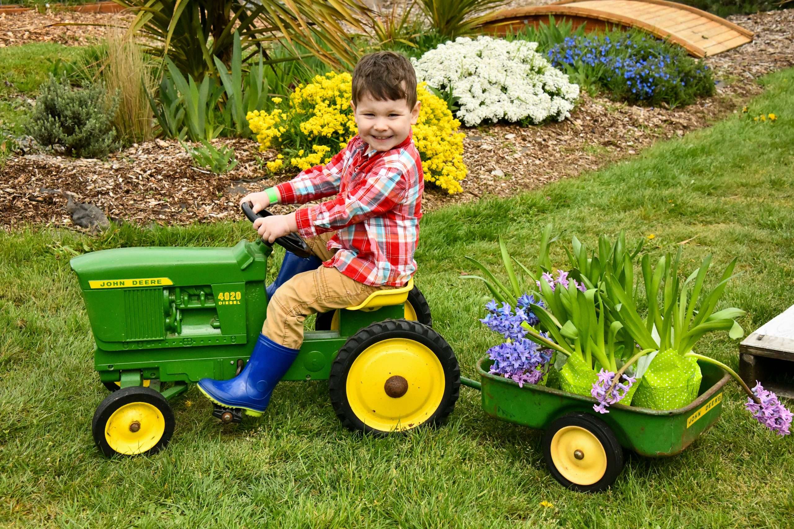 kid on John Deere toy tractor